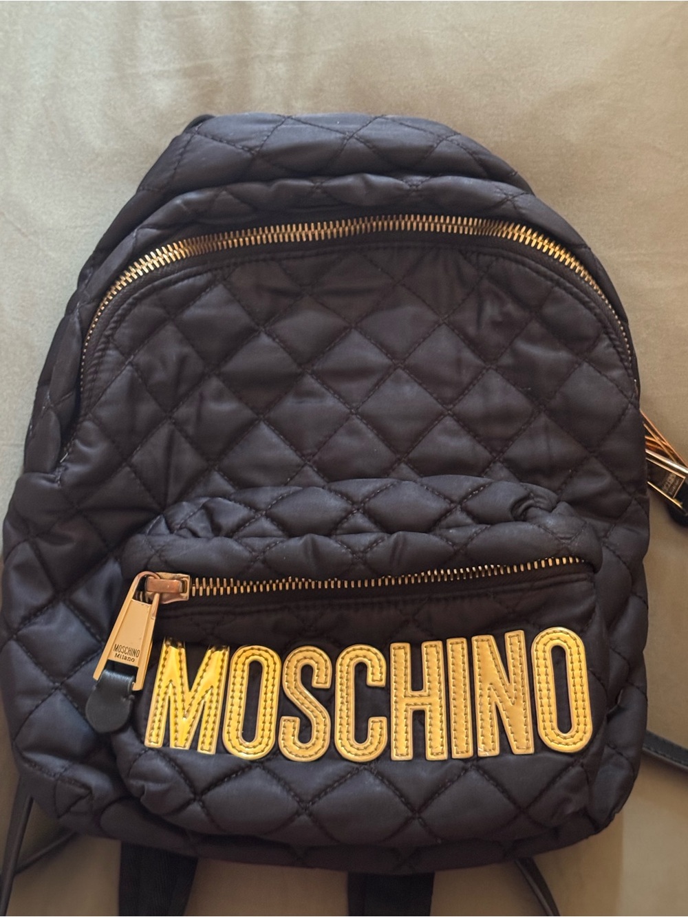 Moschino Black Quilted Backpack with Gold Logo Accents